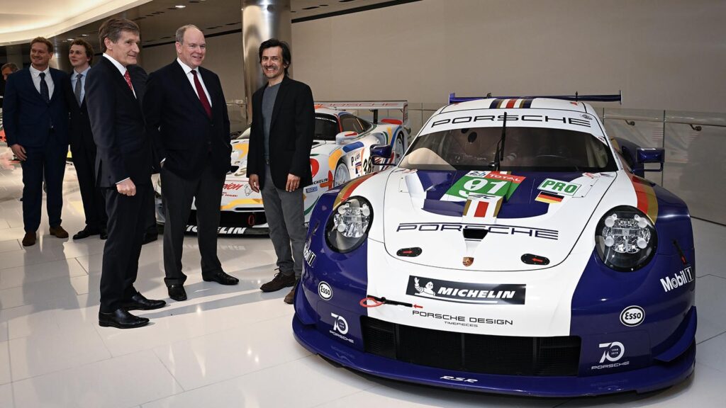 White and Blue Porsche 911 with people