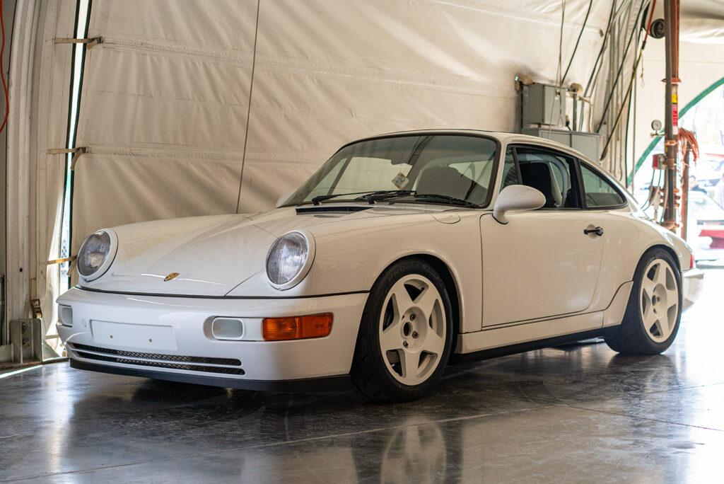 White Porsche 064 tarb in the background