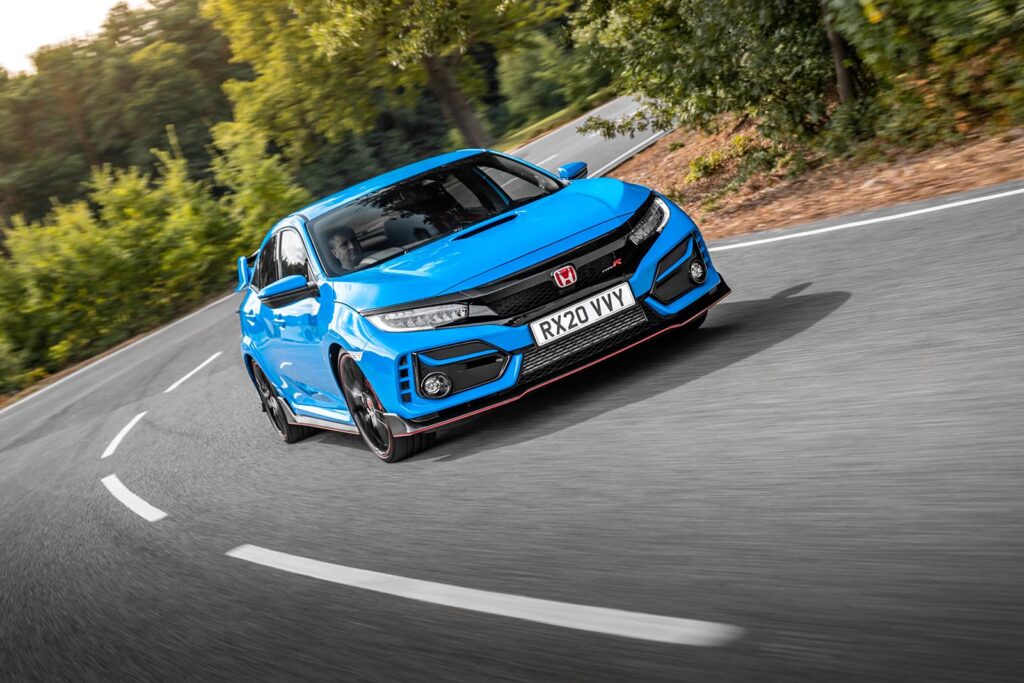 blue honda civic type R on road turning