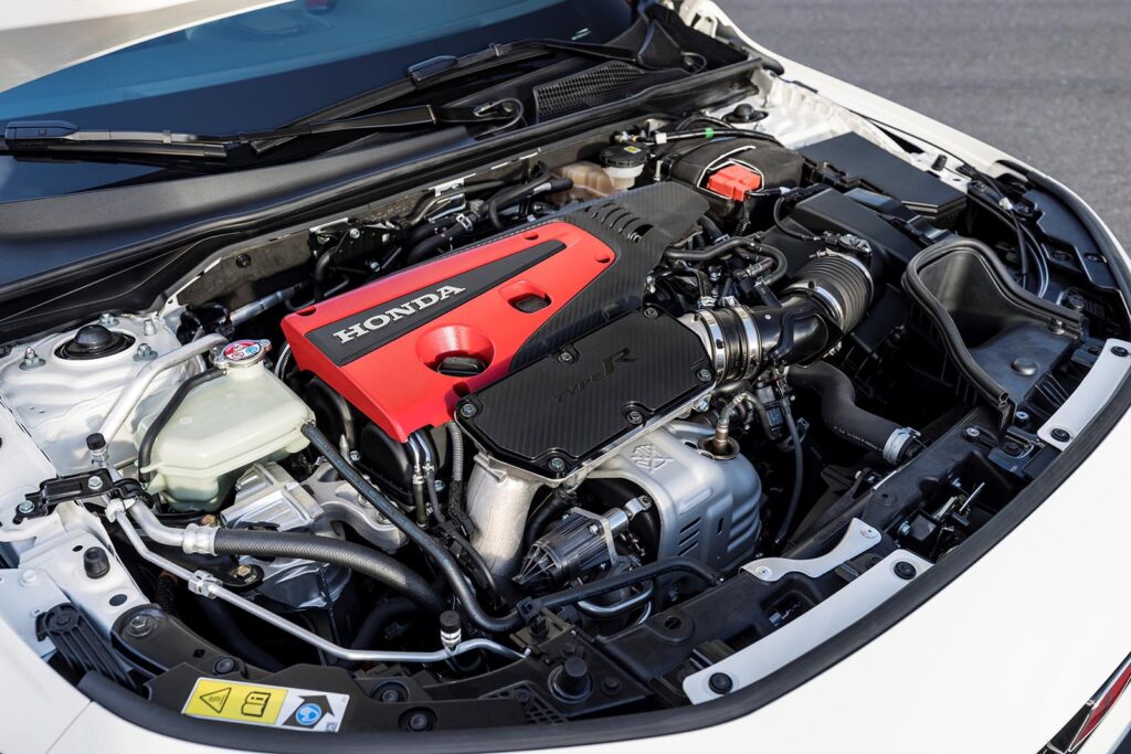 closeup of white civic type R engine bay