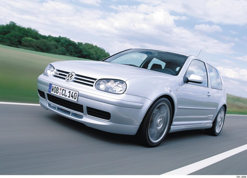 Grey VW GTI driving on road