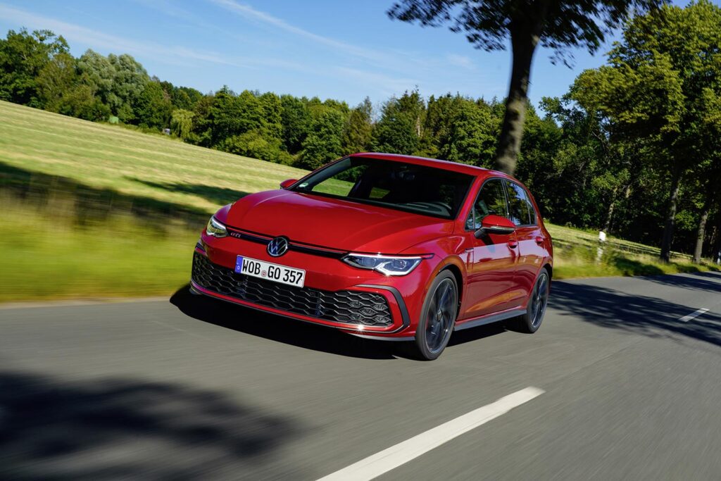 Red VW GTI on road