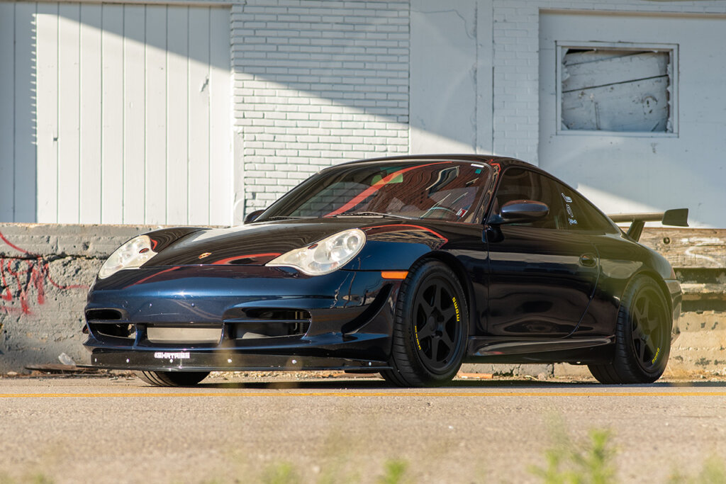 Blue Porsche 911 996 on asphalt