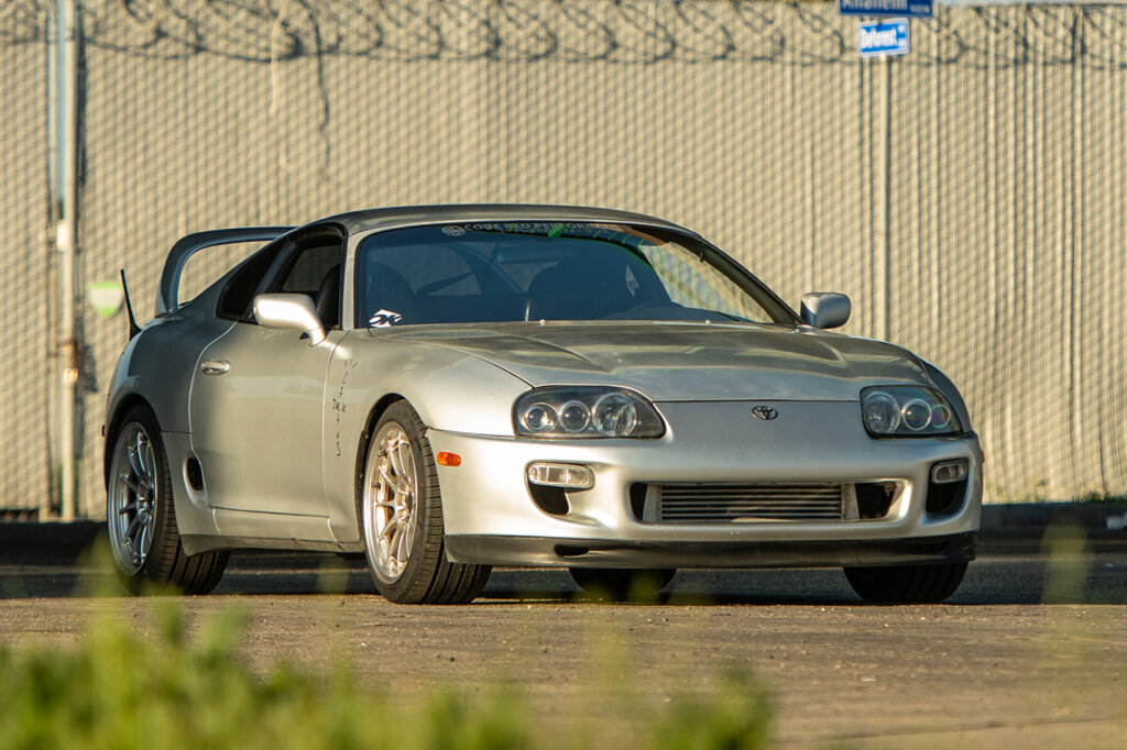 Silver Toyota Supra A90 parked on street