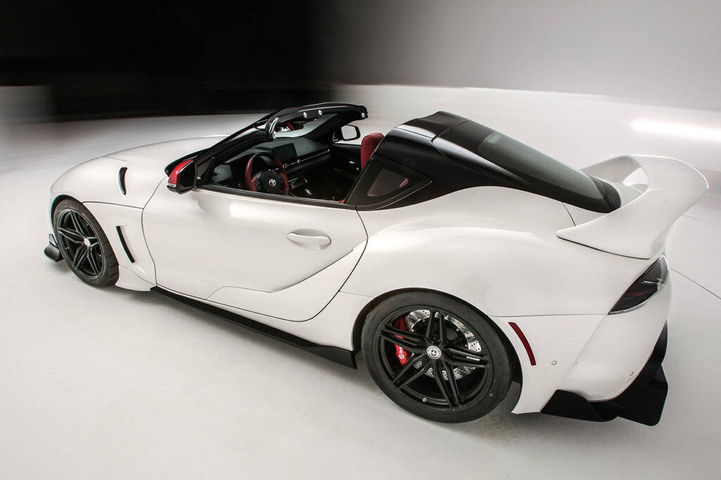 white A90 supra rear 3/4 view in showroom