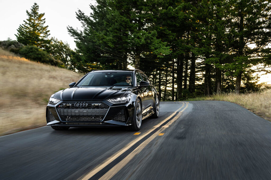 black r6 avant driving through country road