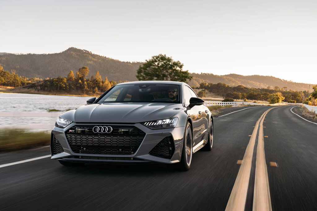 matte grey RS 7 Sportback performance car next to lake