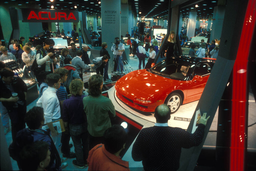 1st gen red honda nsx at a car show
