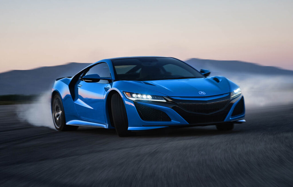 blue 2021 acura nsx drifting on a race circuit