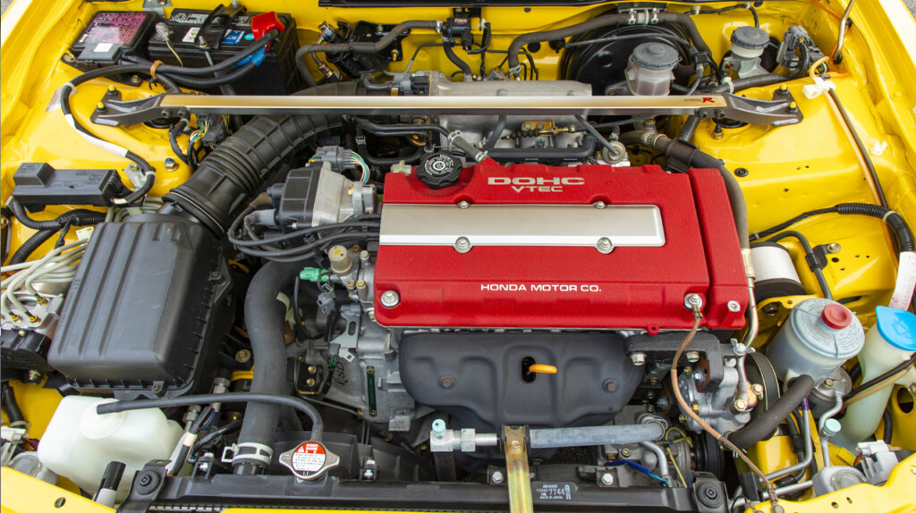 Honda 1.8-liter DOHC VTEC 4-cylinder engine inside a Yellow 2001 Acura Integra
