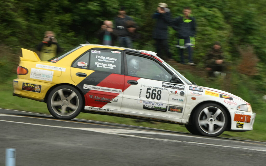 rally ready mitsubishi lancer evo II performing a jump