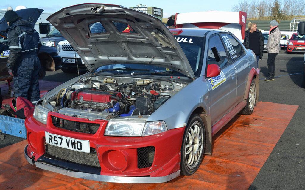 mitsubishi evo 5 engine on display