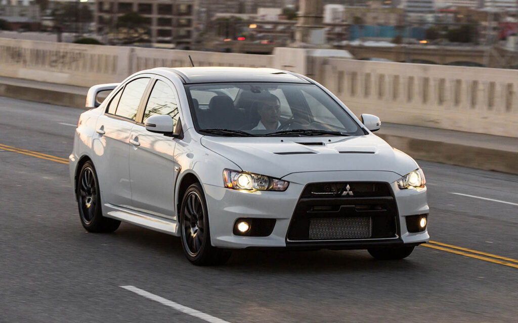 white 2015 mitsubishi lancer evolution on bridge