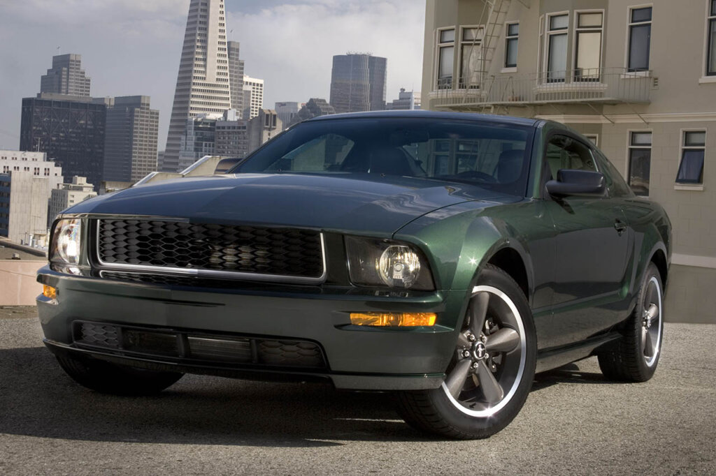 Green 2008 Ford Mustang Bullitt on a city road