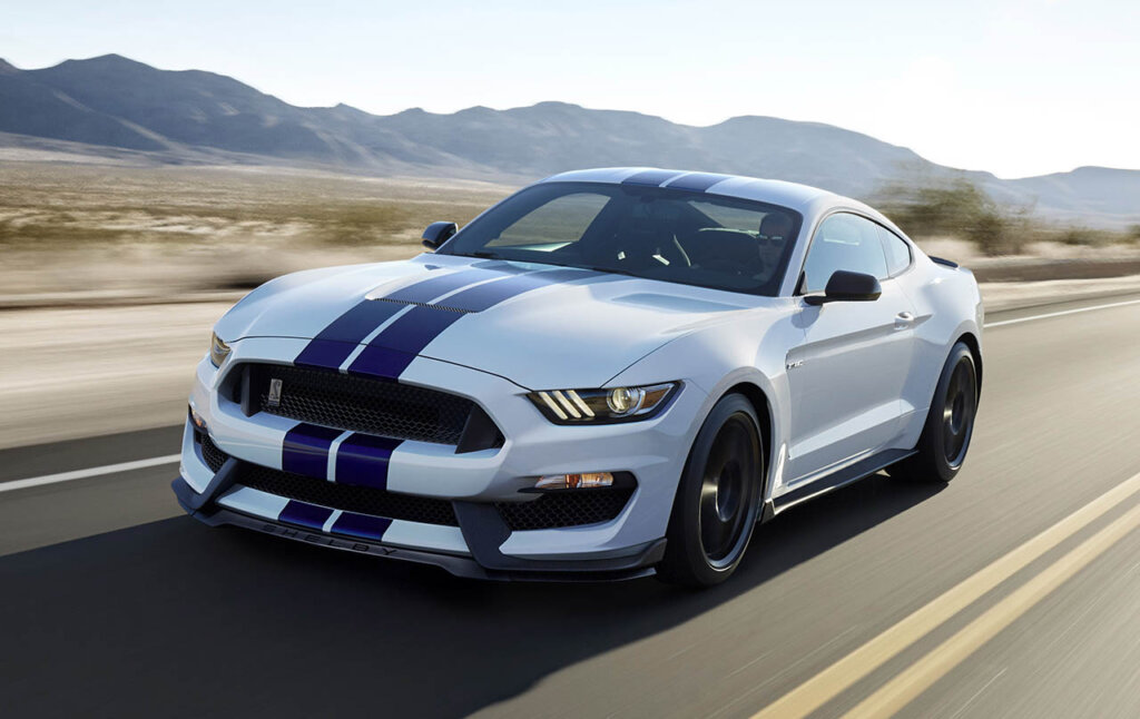 Shelby GT350 Mustang in Oxford White driving on a road