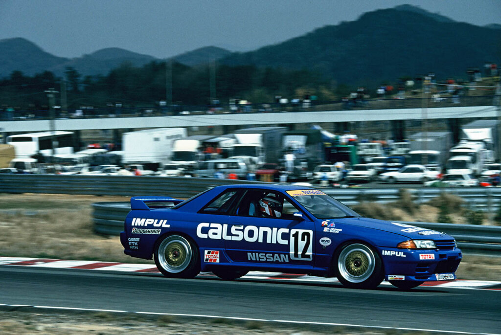 blue nissan nismo r32 skyline on a racetrack