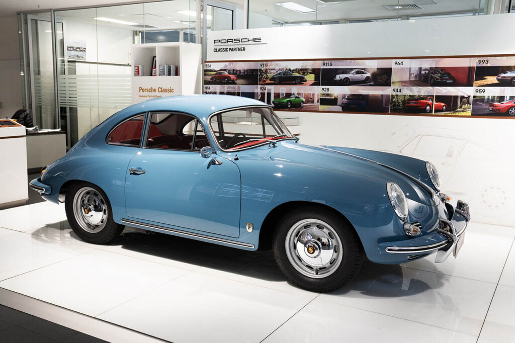 blue porsche 356 B series in a display room