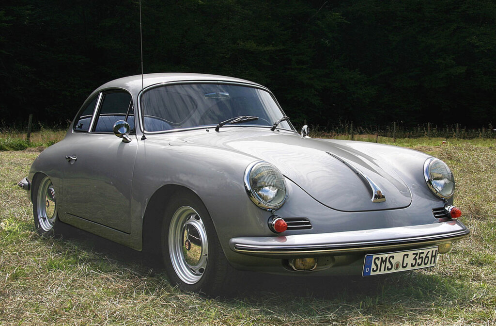 metallic grey porsche 356 C on grass