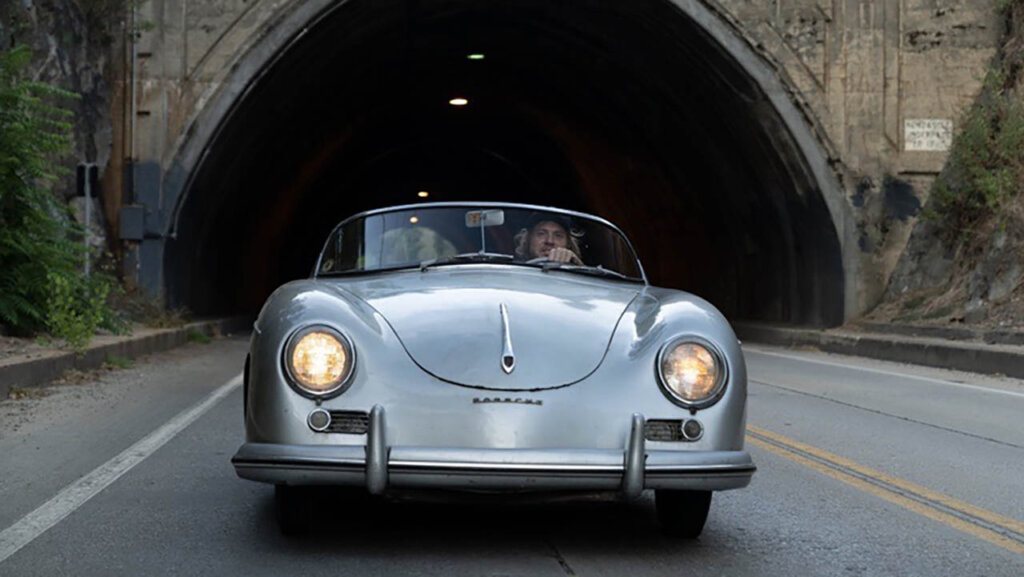 silver 356 pre A speedster driving through tunnel