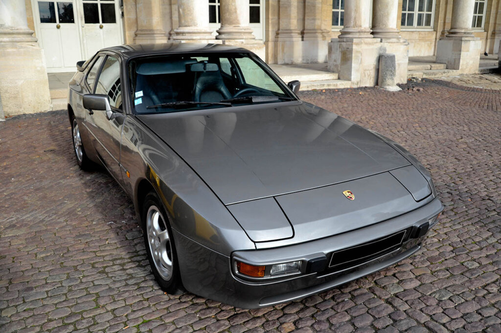 grey porsche 944ss next to building