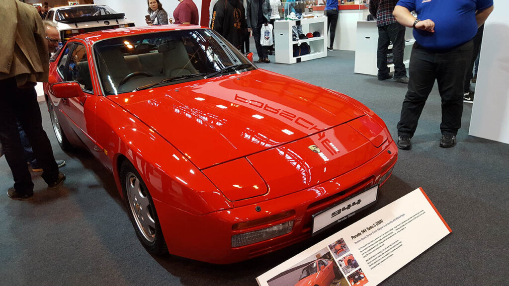 red 1991 porsche 944 s turbo in a display room