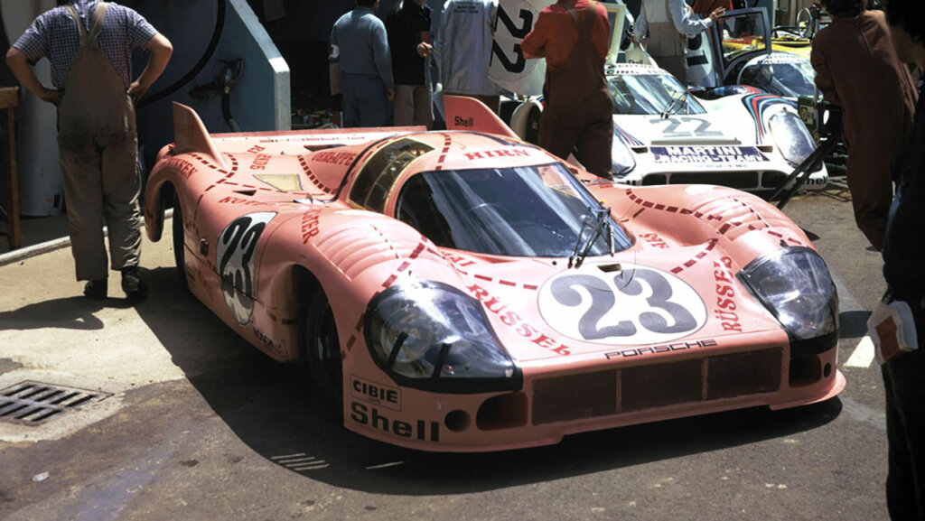 a pink porsche 917/20 on a racetrack