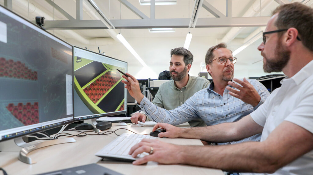 Designers at Porsche discussing the new Porsche crest