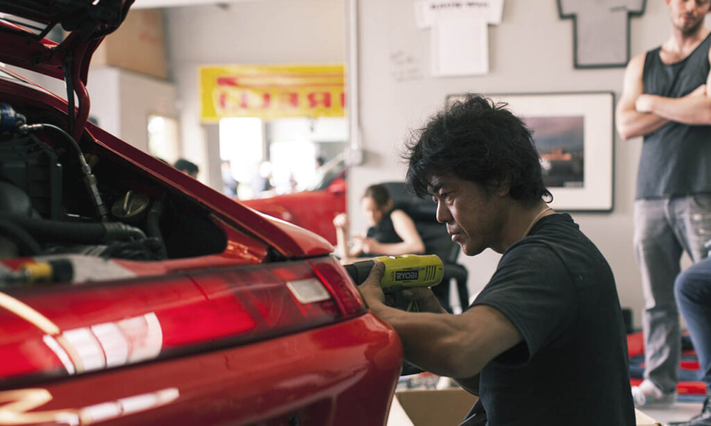 akira nakai tuning a red porsche