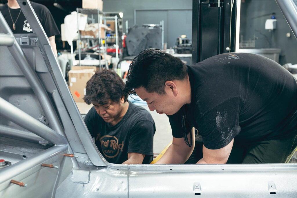 akira nakai working on a rwb car frame