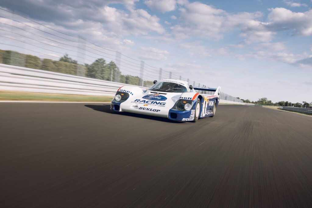 porsche race car with rothmans livery on a race track