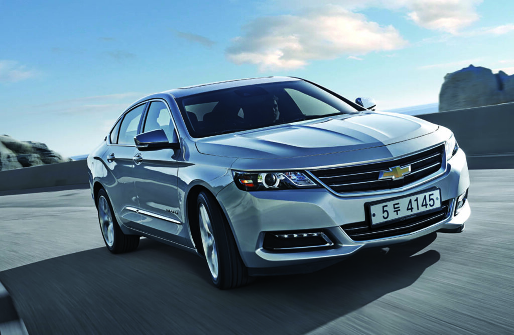 silver chevy impala driving through cliffside