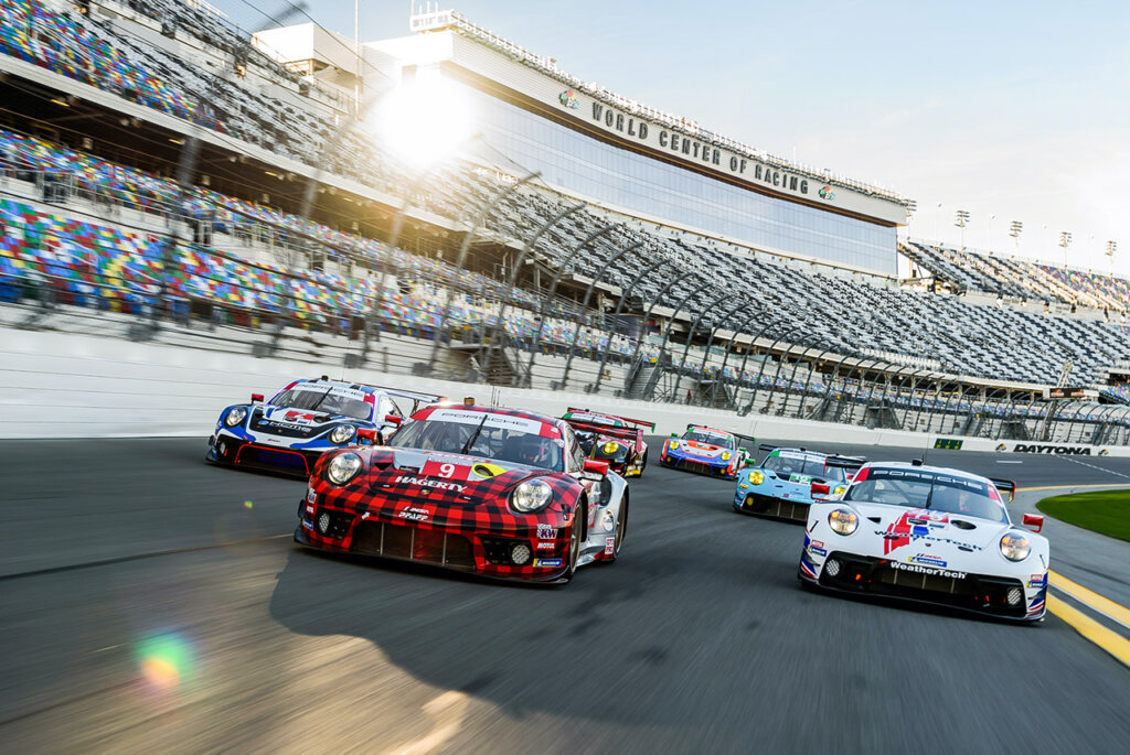 group or porsche 911 GT 3 R cars on a race track