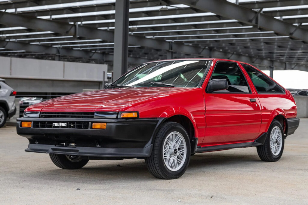 red SR5 Corolla in parking garage