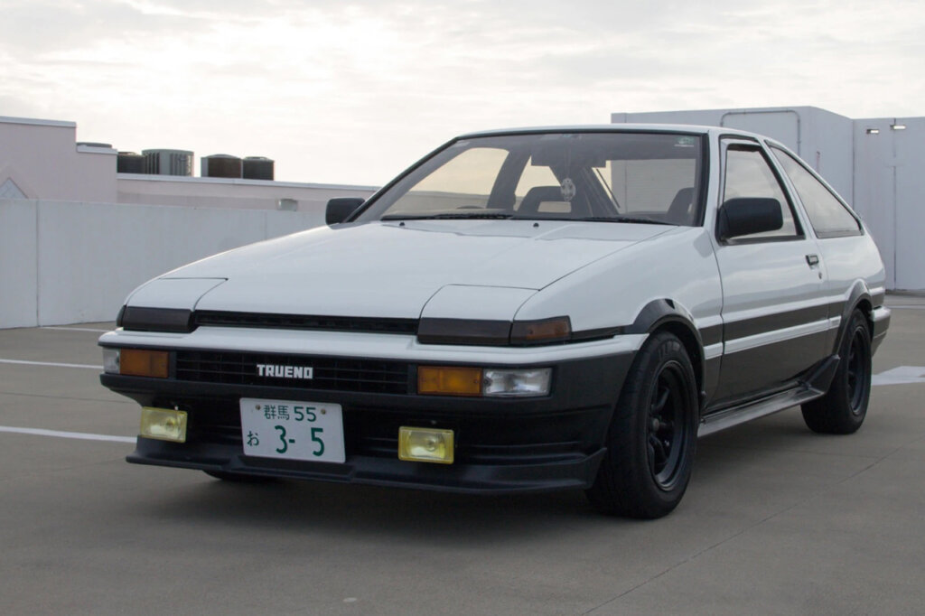white and black Toyota corolla