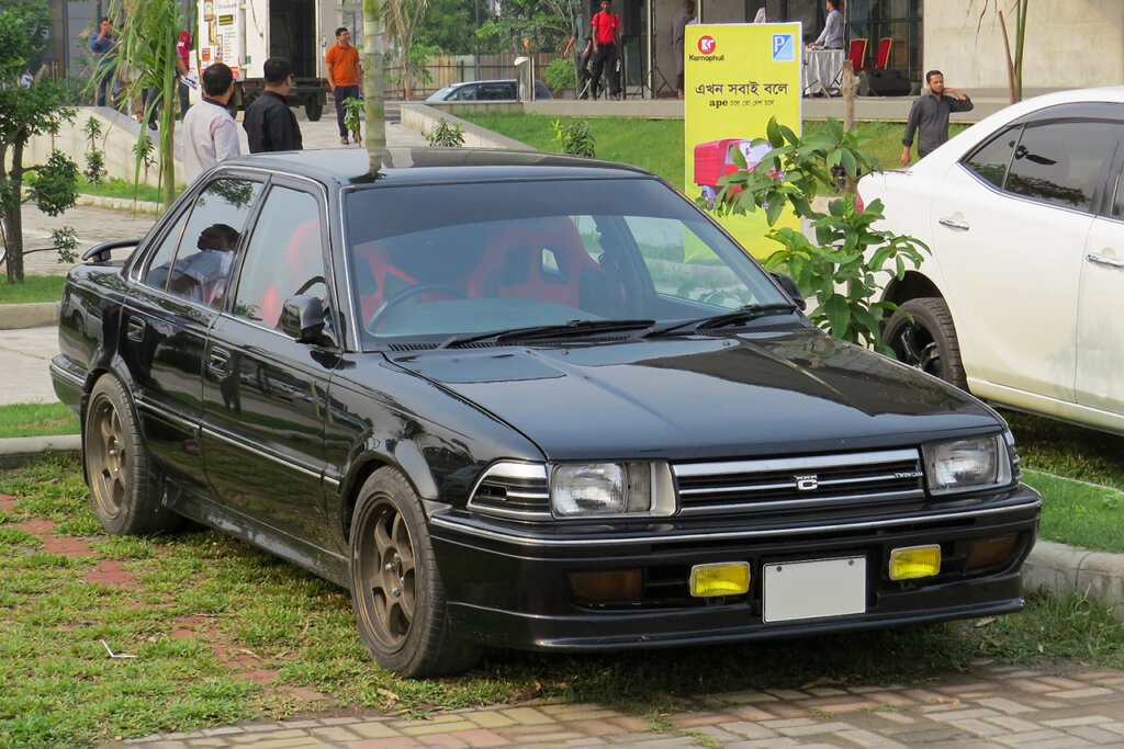 black Corolla AE91 car parked on grass