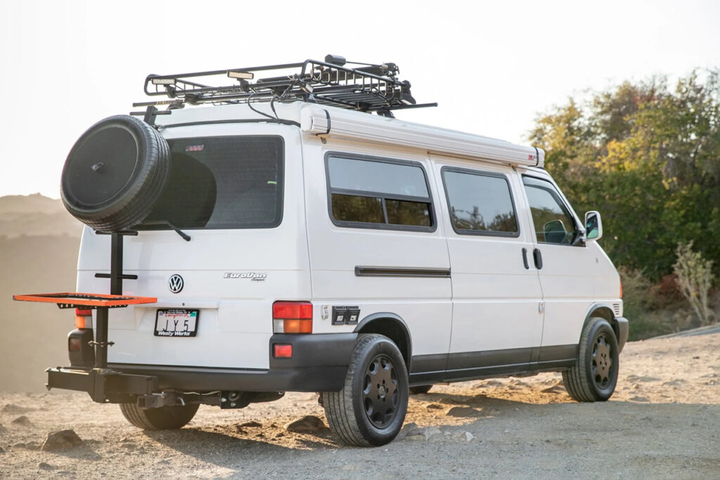 EuroVan VW camper bus on dirt cliff