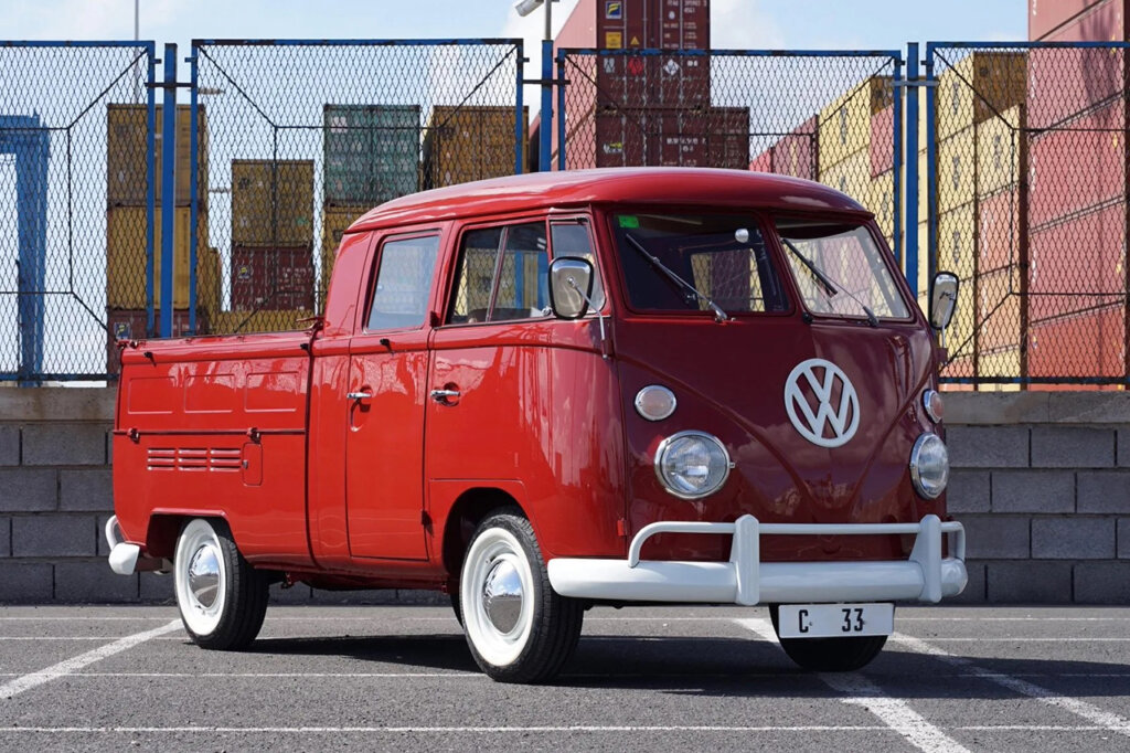 VW transporter Bus infront of shipping containers