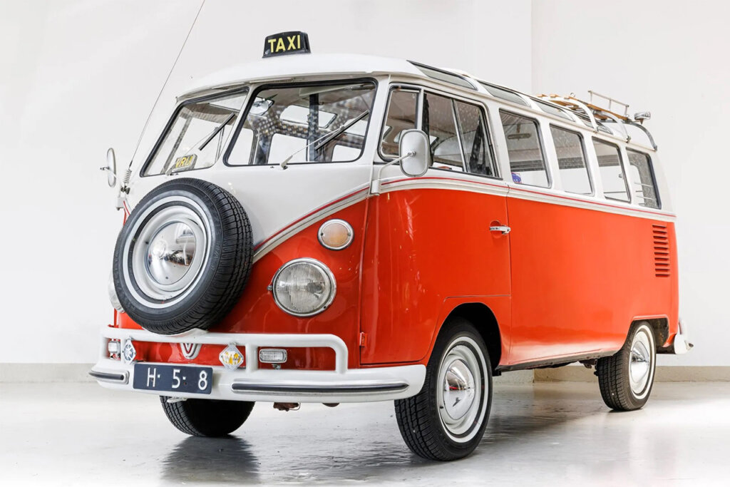 white and orange bus on a white background and concrete