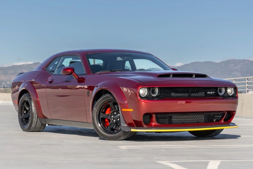 Red Dodge Challenger in parking lot