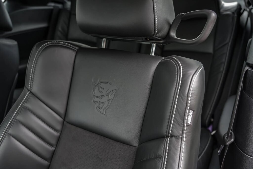 Dodge Demon Black leather drivers seat with the Demon logo on it