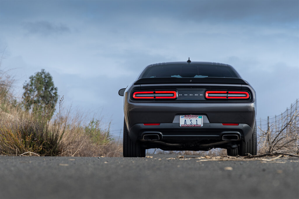 black challenger on parked on road