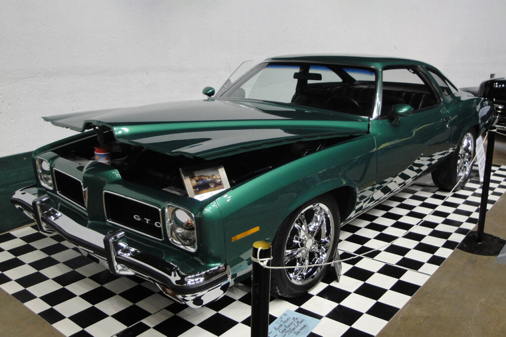 green 1973 GTO on checker board floor
