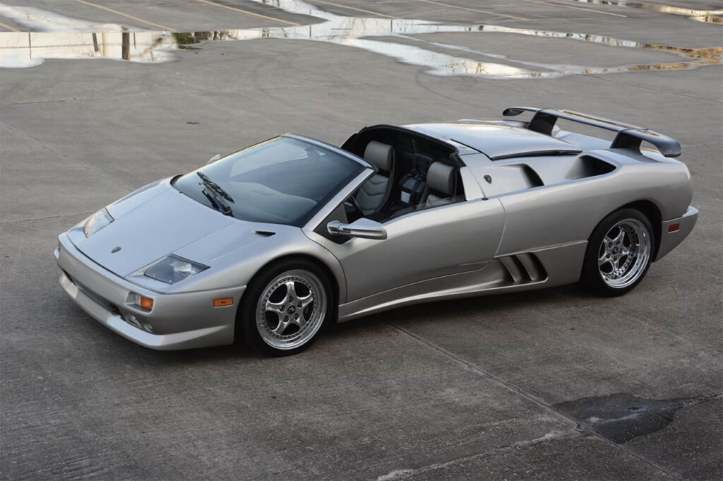 sliver 1999 diablo roaster in a parking lot