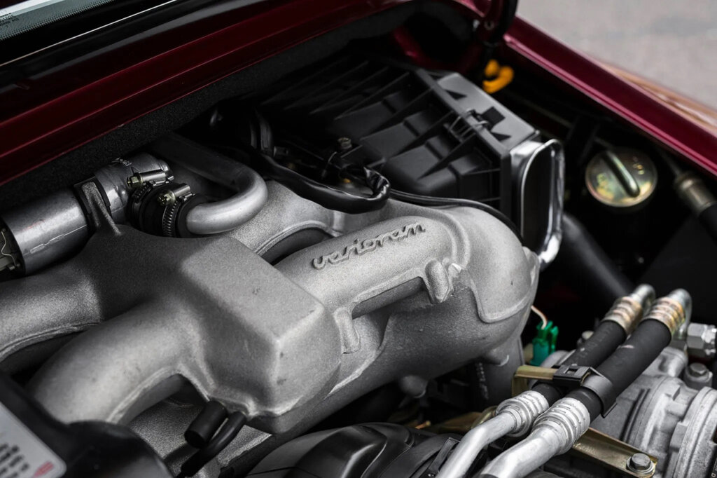 silver intake duct of a Porsche engine