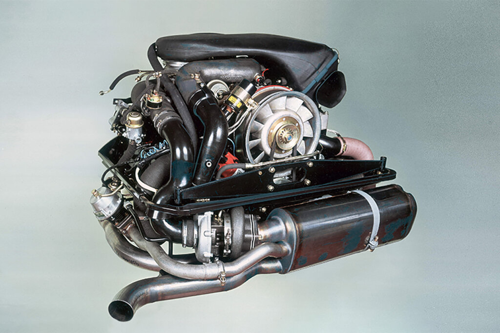 911 3.3L Turbo Flat Six Engine on solid blue background