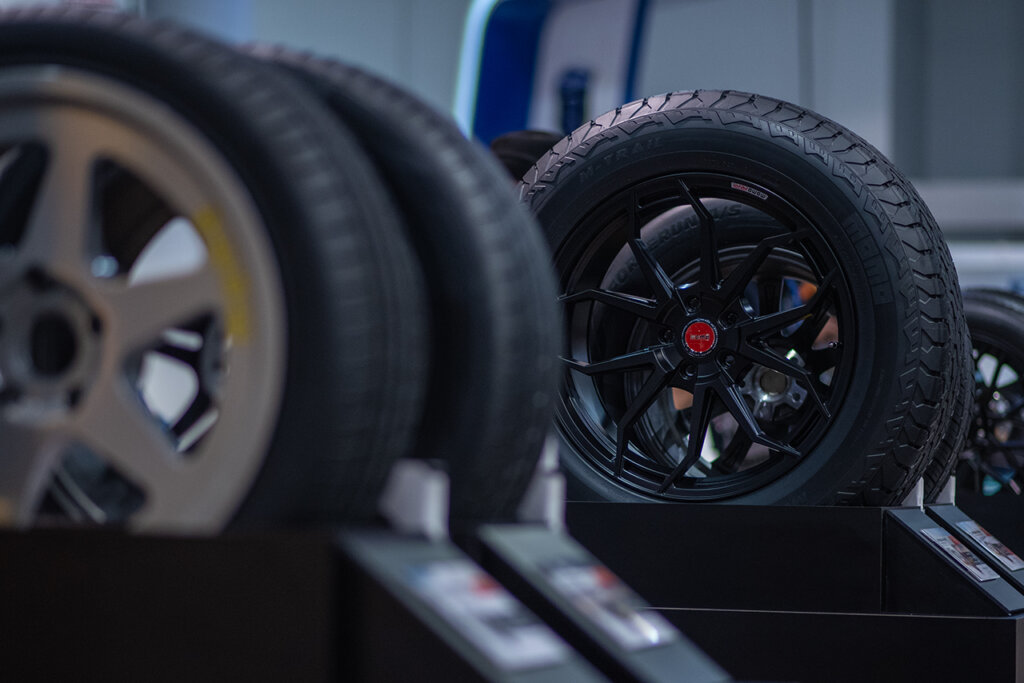 MOMO wheels one tan and one black setup on displays during SEMA