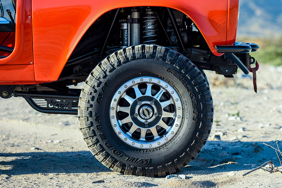 Silver Method Wheels on an Orange Jeep Wrangler