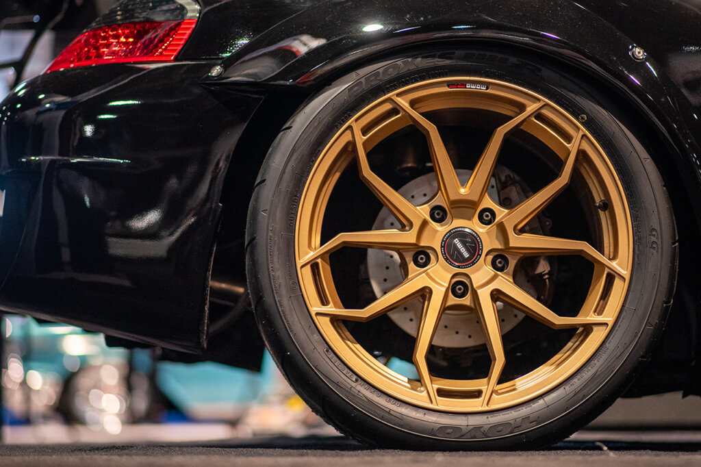 Bronze Flow Form MOMO RF Series Anzio wheels on a black Porsche