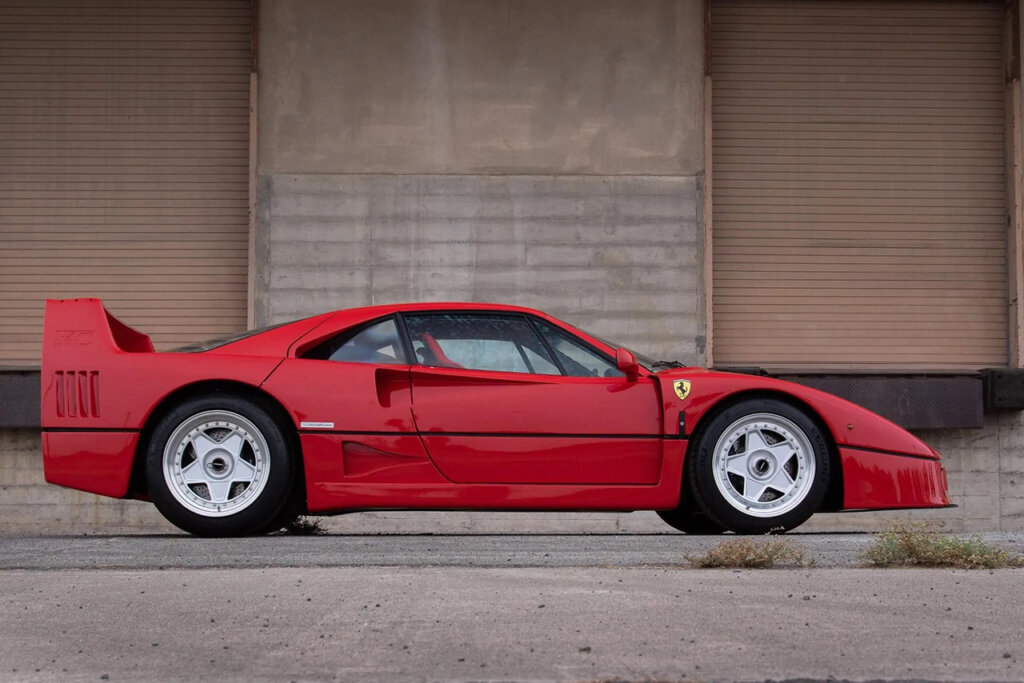 Side profile of a car in front of some garage doors
