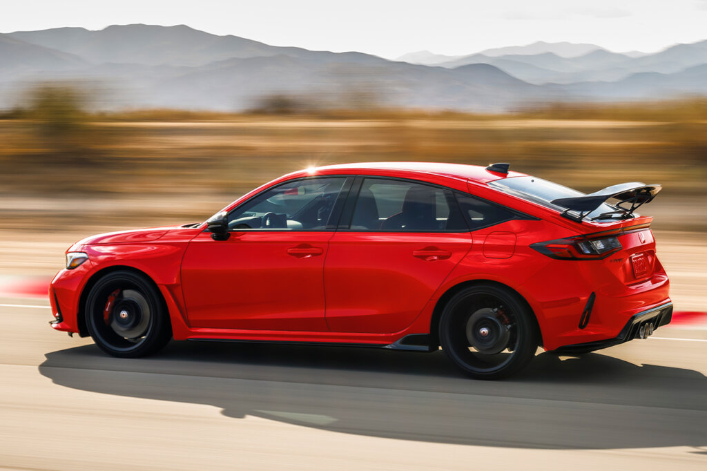red FL5 Honda Civic driving fast mountains in the background